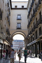 Spain, Madrid, Archway leading to the Plaza Mayor.