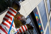 Germany, Berlin, Mitte, A United Buddy Bear by sculptor Roman Strobl promoting international peace, tolerance and understanding outside a shop selling city souvenirs.