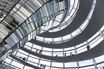 Germany, Berlin, Mitte, Tiergarten, interior of the glass dome on the top of the Reichstag building designed by architect Norman Foster with a double-helix spiral ramp around the mirrored cone that re...