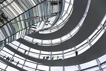 Germany, Berlin, Mitte, Tiergarten, interior of the glass dome on the top of the Reichstag building designed by architect Norman Foster with a double-helix spiral ramp around the mirrored cone that re...