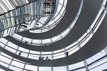 Germany, Berlin, Mitte, Tiergarten, interior of the glass dome on the top of the Reichstag building designed by architect Norman Foster with a double-helix spiral ramp around the mirrored cone that re...