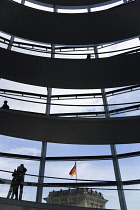 Germany, Berlin, Mitte, Tiergarten, interior of the glass dome on the top of the Reichstag building designed by architect Norman Foster with a double-helix spiral ramp around the mirrored cone that re...