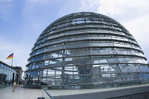 Germany, Berlin, Mitte, Tiergarten, exterior of the glass dome on the top of the Reichstag building designed by architect Norman Foster with a double-helix spiral ramp around the mirrored cone that re...