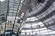 Germany, Berlin, Mitte, Tiergarten, interior of the glass dome on the top of the Reichstag building designed by architect Norman Foster with a double-helix spiral ramp around the mirrored cone that re...