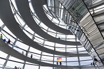 Germany, Berlin, Mitte, Tiergarten, interior of the glass dome on the top of the Reichstag building designed by architect Norman Foster with a double-helix spiral ramp around the mirrored cone that re...