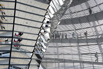 Germany, Berlin, Mitte, Tiergarten, interior of the glass dome on the top of the Reichstag building designed by architect Norman Foster with a double-helix spiral ramp around the mirrored cone that re...