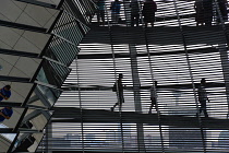 Germany, Berlin, Mitte, Tiergarten, interior of the glass dome on the top of the Reichstag building designed by architect Norman Foster with a double-helix spiral ramp around the mirrored cone that re...
