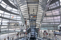 Germany, Berlin, Mitte, Tiergarten, interior of the glass dome on the top of the Reichstag building designed by architect Norman Foster with a double-helix spiral ramp around the mirrored cone that re...