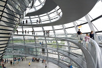 Germany, Berlin, Mitte, Tiergarten, interior of the glass dome on the top of the Reichstag building designed by architect Norman Foster with a double-helix spiral ramp around the mirrored cone that re...