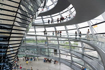 Germany, Berlin, Mitte, Tiergarten, interior of the glass dome on the top of the Reichstag building designed by architect Norman Foster with a double-helix spiral ramp around the mirrored cone that re...