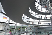 Germany, Berlin, Mitte, Tiergarten, interior of the glass dome on the top of the Reichstag building designed by architect Norman Foster with a double-helix spiral ramp around the mirrored cone that re...