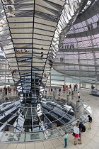 Germany, Berlin, Mitte, Tiergarten, interior of the glass dome on the top of the Reichstag building designed by architect Norman Foster with a double-helix spiral ramp around the mirrored cone that re...