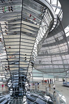 Germany, Berlin, Mitte, Tiergarten, interior of the glass dome on the top of the Reichstag building designed by architect Norman Foster with a double-helix spiral ramp around the mirrored cone that re...