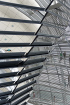 Germany, Berlin, Mitte, Tiergarten, interior of the glass dome on the top of the Reichstag building designed by architect Norman Foster with a double-helix spiral ramp around the mirrored cone that re...