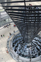 Germany, Berlin, Mitte, Tiergarten, interior of the glass dome on the top of the Reichstag building designed by architect Norman Foster with a double-helix spiral ramp around the mirrored cone that re...