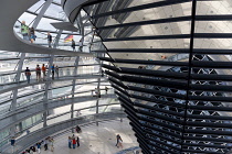 Germany, Berlin, Mitte, Tiergarten, interior of the glass dome on the top of the Reichstag building designed by architect Norman Foster with a double-helix spiral ramp around the mirrored cone that re...