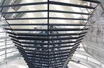 Germany, Berlin, Mitte, Tiergarten, interior of the glass dome on the top of the Reichstag building designed by architect Norman Foster with a double-helix spiral ramp around the mirrored cone that re...