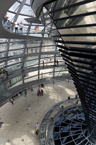 Germany, Berlin, Mitte, Tiergarten, interior of the glass dome on the top of the Reichstag building designed by architect Norman Foster with a double-helix spiral ramp around the mirrored cone that re...