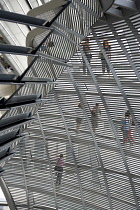Germany, Berlin, Mitte, Tiergarten, interior of the glass dome on the top of the Reichstag building designed by architect Norman Foster with a double-helix spiral ramp around the mirrored cone that re...