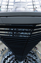 Germany, Berlin, Mitte, Tiergarten, interior of the glass dome on the top of the Reichstag building designed by architect Norman Foster with a double-helix spiral ramp around the mirrored cone that re...