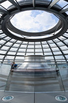 Germany, Berlin, Mitte, Tiergarten, interior of the glass dome on the top of the Reichstag building designed by architect Norman Foster with the hot air vent on top of the mirrored cone that reflect l...