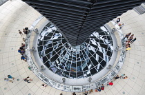 Germany, Berlin, Mitte, Tiergarten, interior of the glass dome on the top of the Reichstag building designed by architect Norman Foster with a double-helix spiral ramp around the mirrored cone that re...