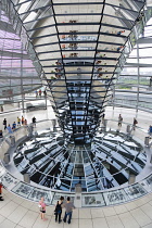 Germany, Berlin, Mitte, Tiergarten, interior of the glass dome on the top of the Reichstag building designed by architect Norman Foster with a double-helix spiral ramp around the mirrored cone that re...