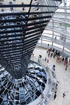 Germany, Berlin, Mitte, Tiergarten, interior of the glass dome on the top of the Reichstag building designed by architect Norman Foster with a double-helix spiral ramp around the mirrored cone that re...