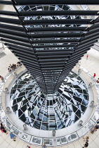 Germany, Berlin, Mitte, Tiergarten, interior of the glass dome on the top of the Reichstag building designed by architect Norman Foster with a double-helix spiral ramp around the mirrored cone that re...