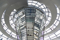 Germany, Berlin, Mitte, Tiergarten, interior of the glass dome on the top of the Reichstag building designed by architect Norman Foster with a double-helix spiral ramp around the mirrored cone that re...