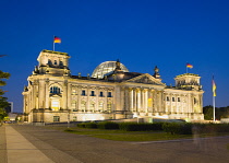 Germany, Berlin, Mitte, The Reichstag building in Tiergarten illuminated at night.