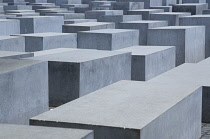 Germany, Berlin, Mitte, Holocaust Memorial designed by US architect Peter Eisenmann with a field of grey slabs symbolizing the millions of Jews killed by the Nazis.