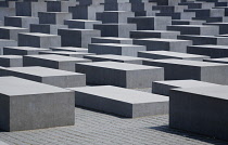 Germany, Berlin, Mitte, Holocaust Memorial designed by US architect Peter Eisenmann with a field of grey slabs symbolizing the millions of Jews killed by the Nazis.