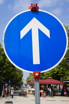 Germany, Berlin, Mitte, temporary blue one way traffic control roadsign on Unter den Linden.