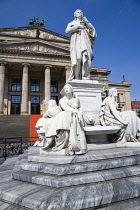 Germany, Berlin, Mitte, The Gendarmenmarkt square with a statue of the German poet and philosopher Friedrich Schiller in front of the Konzerthaus Concert Hall, home to the Berlin Symphony Orchestra.