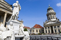 Germany, Berlin, Mitte, The Gendarmenmarkt square with a statue of the German poet and philosopher Friedrich Schiller between the Konzerthaus Concert Hall, home to the Berlin Symphony Orchestra, and T...