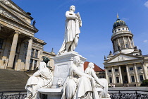 Germany, Berlin, Mitte, The Gendarmenmarkt square with a statue of the German poet and philosopher Friedrich Schiller between the Konzerthaus Concert Hall, home to the Berlin Symphony Orchestra, and T...