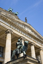 Germany, Berlin, Mitte, The Konzerthaus Concert Hall, home of the Berlin Symphony Orchestra, entrance portico with a bronze statue of a muse playing music seated on a panther.