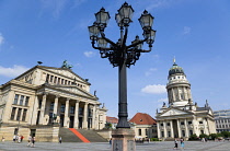 Germany, Berlin, Mitte, The Gendarmenmarkt square with an ornate lamp-post between the Konzerthaus Concert Hall, home to the Berlin Symphony Orchestra, and The French Cathedral, Franzosischer Dom.