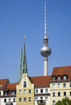 Germany, Berlin, Mitte, buildings beside the River Spree in the St Nicholas Quarter, the Nikolaiviertel, with the twin spired church of St Nicholas, the oldest church in the city and the Fernsehturm T...