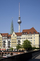 Germany, Berlin, Mitte, buildings beside the River Spree in the St Nicholas Quarter, the Nikolaiviertel, with the twin spired church of St Nicholas, the oldest church in the city and the Fernsehturm T...