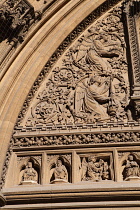 England, Bristol, Detail of the engravings on the arch above the main door to Bristol Cathedral.