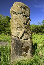 Ireland, County Fermanagh, Boa Island, Carved stone pagan figures that stand in Caldragh cemetery.