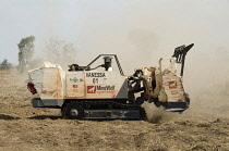 Angola, Mine Wolf Systems radio controlled automated mine clearance machine 'Vanessa' looking for unexploded ordenance.