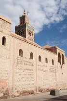 Morocco, Marrakech, Koutoubia Mosque behind old city walls.