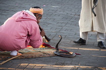 Morocco, Marrakech, Snake charmer in in Djemaa el Fna square.