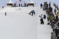 Norway, Oslo, Tryvann Winter Park, Competitor during Arctic Challenge half pipe snow board competition.