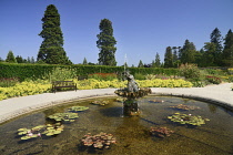 Ireland, County Wicklow, Enniskerry, Powerscourt House and Gardens, A fountain and pond in the Walled Garden.