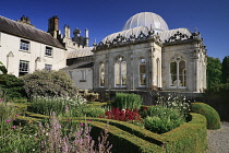 Ireland, County Wicklow, Bray, Kilruddery House and Gardens, View from the west side featuring the domed Orangery building with formal gardens in the foreground.
