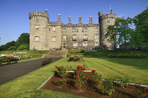 Ireland, County Kilkenny, Kilkenny, Kilkenny Castle with the Rose Garden in the foreground.